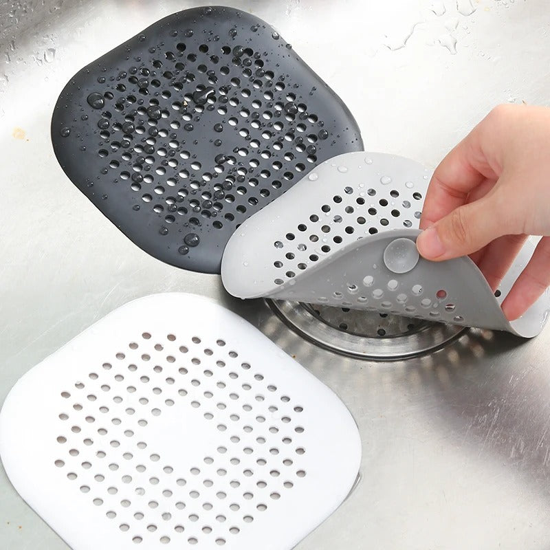 Avloppsfilter i silikon i vitt och grått