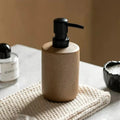 Beige keramisk tvåldispenser med svart pump