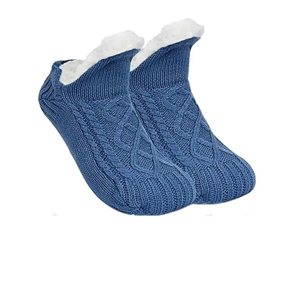 Blå stickade toffelsockor med vitt foder